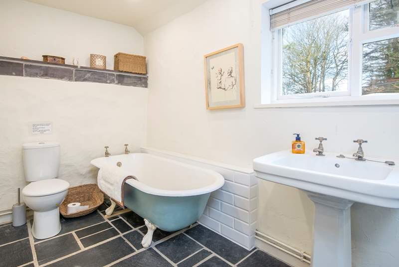Lovely deep bath with a separate shower in the family bathroom on the lower ground floor. 