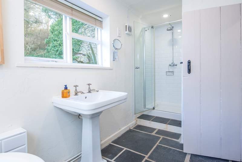 Family bathroom on the lower ground floor with bath and separate shower. 