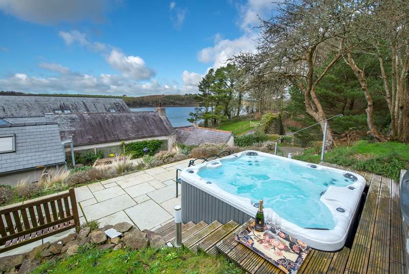 Gorgeous bubbly hot tub with splendid river views. Just relax!