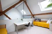 Stairs lead to the mezzanine floor.