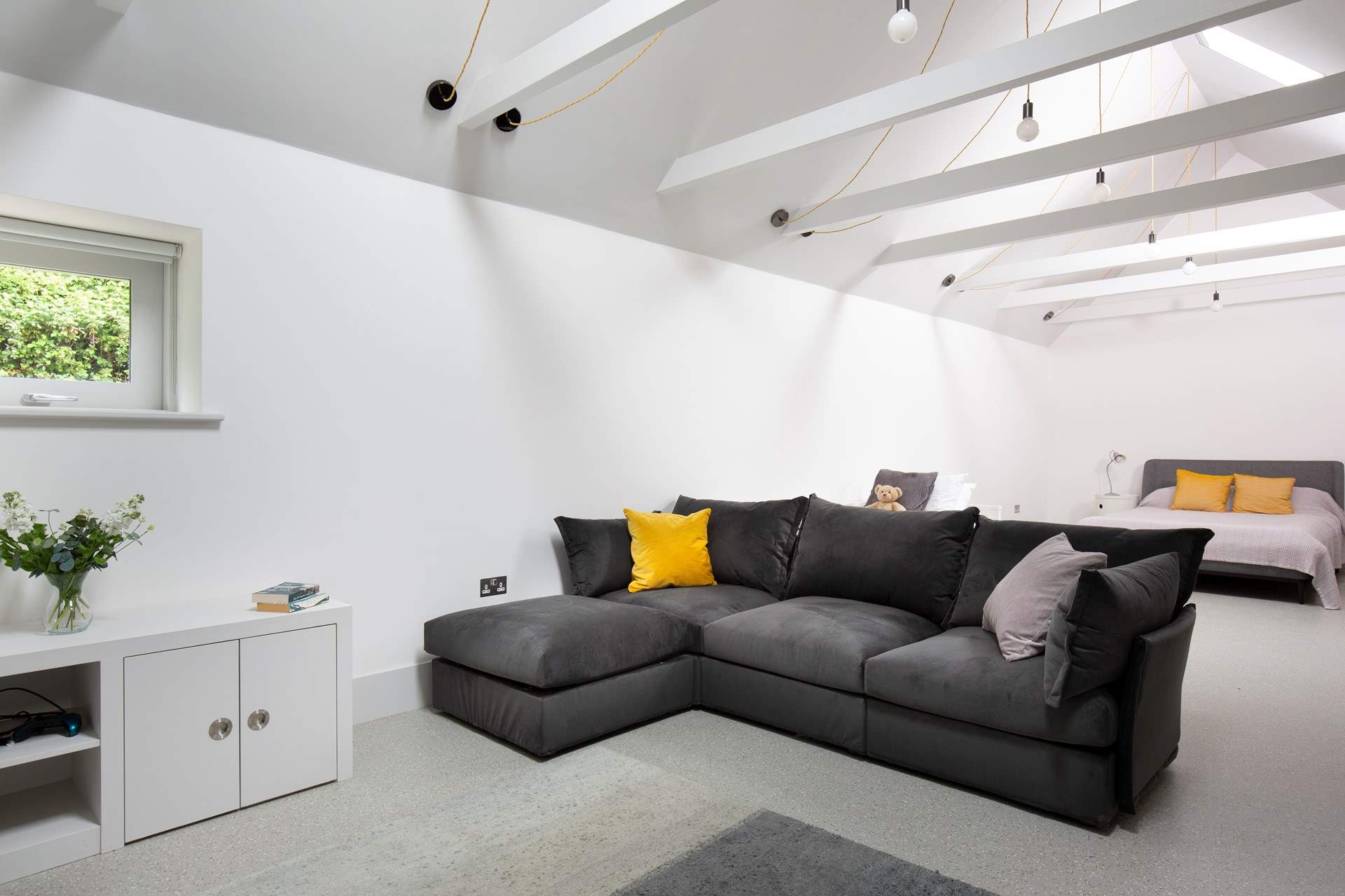 To the back of Pickeridge Hall there is a very large ground floor open plan bedroom/living area featuring a king-size double bed, single bed and an en suite bathroom.