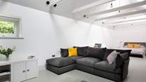 To the back of Pickeridge Hall there is a very large ground floor open plan bedroom/living area featuring a king-size double bed, single bed and an en suite bathroom.