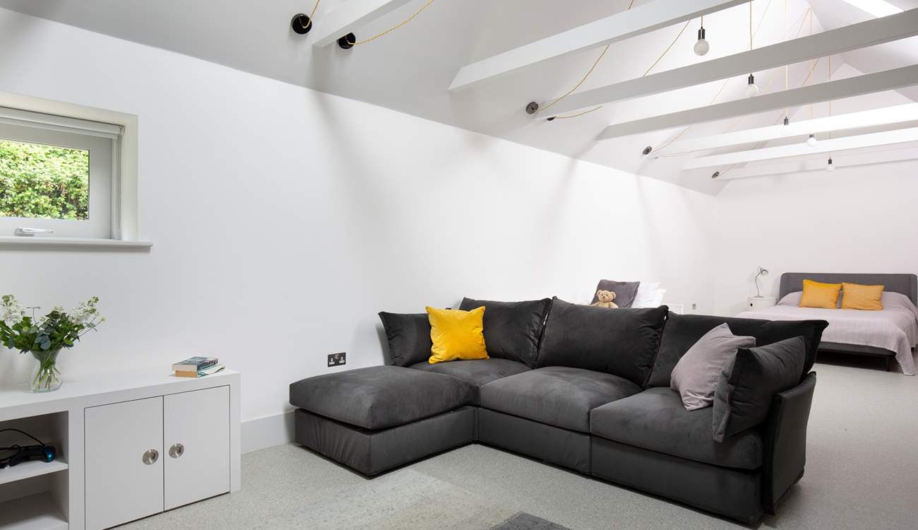 To the back of Pickeridge Hall there is a very large ground floor open plan bedroom/living area featuring a king-size double bed, single bed and an en suite bathroom.