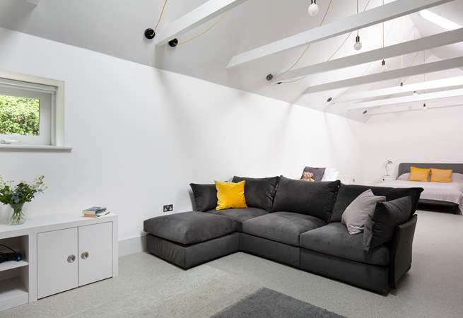 To the back of Pickeridge Hall there is a very large ground floor open plan bedroom/living area featuring a king-size double bed, single bed and an en suite bathroom.