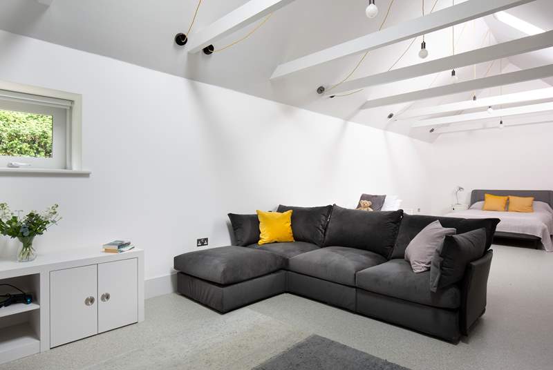 To the back of Pickeridge Hall there is a very large ground floor open plan bedroom/living area featuring a king-size double bed, single bed and an en suite bathroom.