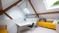 Upstairs the mezzanine floor has two single beds.