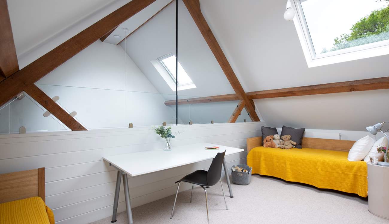 Upstairs the mezzanine floor has two single beds.