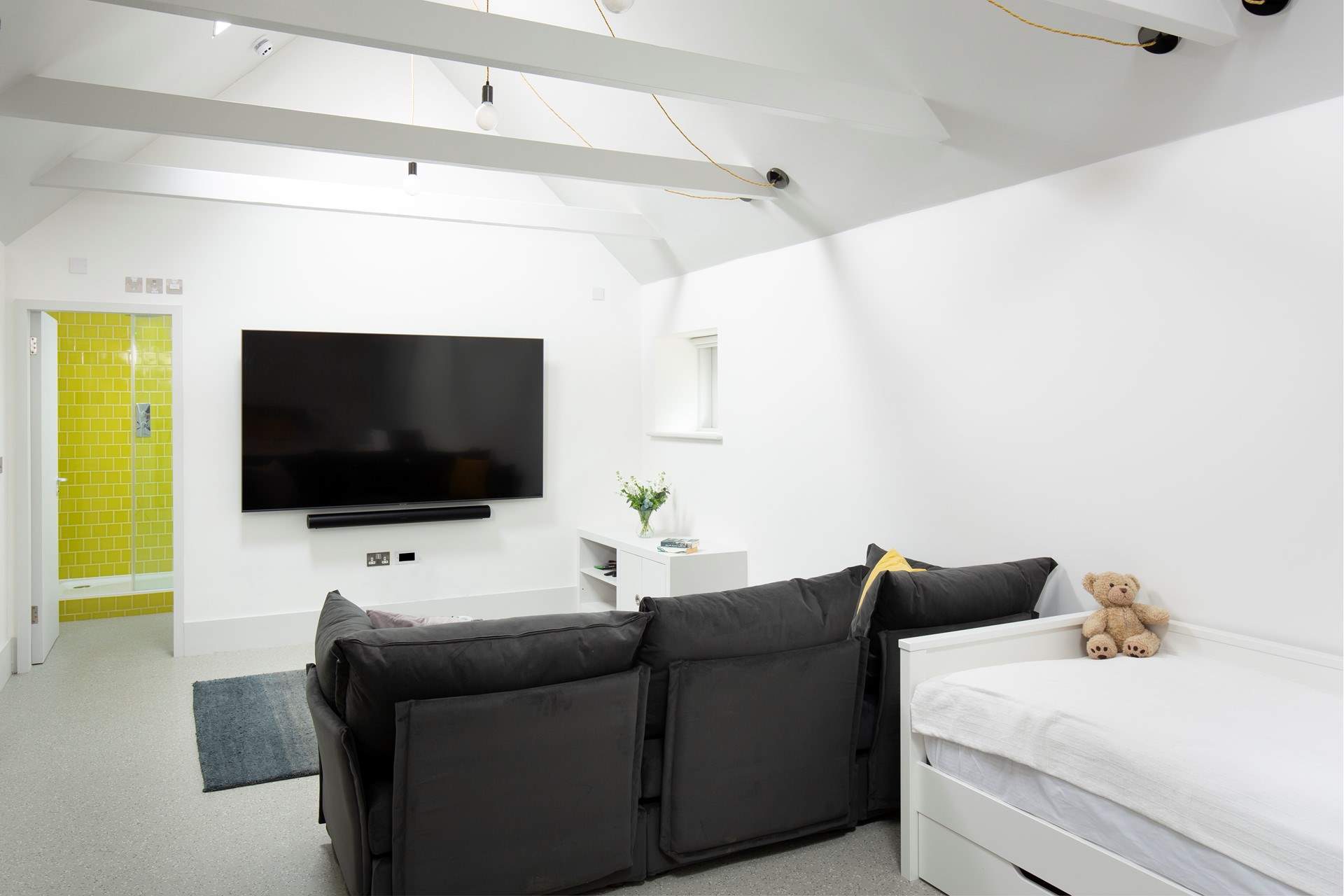 There is a lounge area with a really comfortable sofa and huge Smart TV.