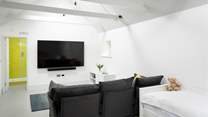 There is a lounge area with a really comfortable sofa and huge Smart TV.