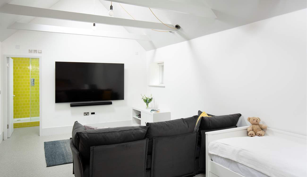 There is a lounge area with a really comfortable sofa and huge Smart TV.