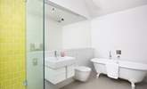 The en suite bathroom has a free-standing bath and walk-in shower. - Thumbnail Image