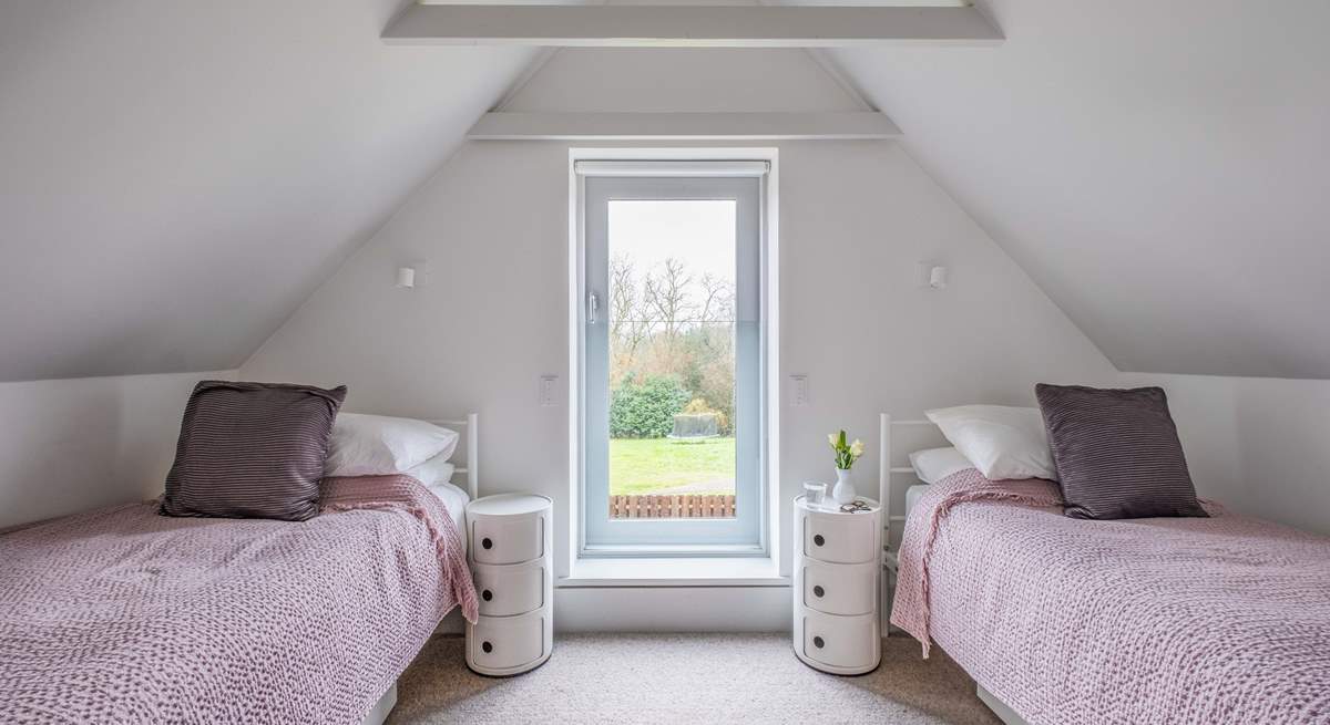 This twin room in South Barn has lovely views over the garden.