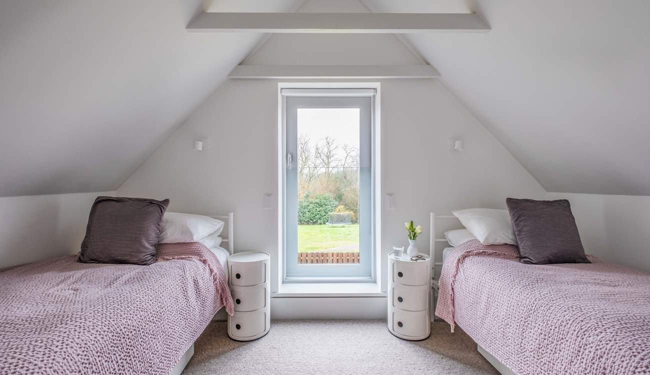 This twin room in South Barn has lovely views over the garden.