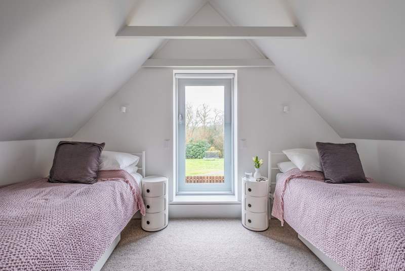 This twin room in South Barn has lovely views over the garden.