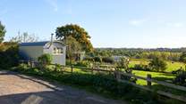 Parking is opposite the barn along side this fence which borders the neighbour's property.