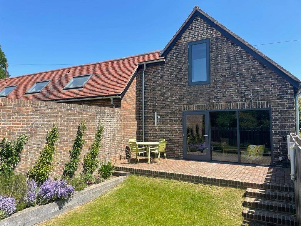 The secure garden in South Barn is perfect for guests bringing a dog.