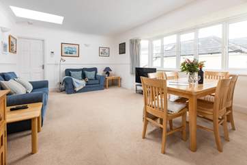 The sitting/dining-room has plenty of space for four guests.