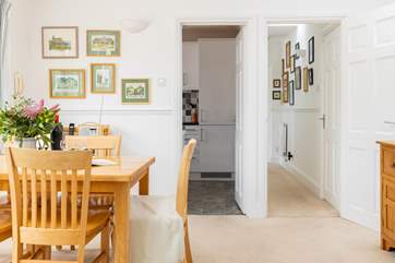 The separate kitchen leads off the dining area.
