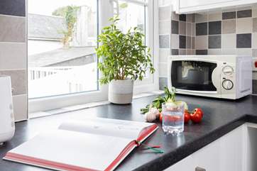 The compact kitchen has everything you will need.