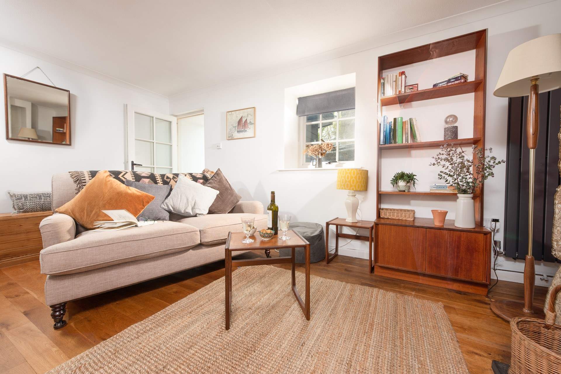 Bythmoy offers contemporary living at its best. Take a step down from the sitting-room out to the hallway and open plan kitchen area.