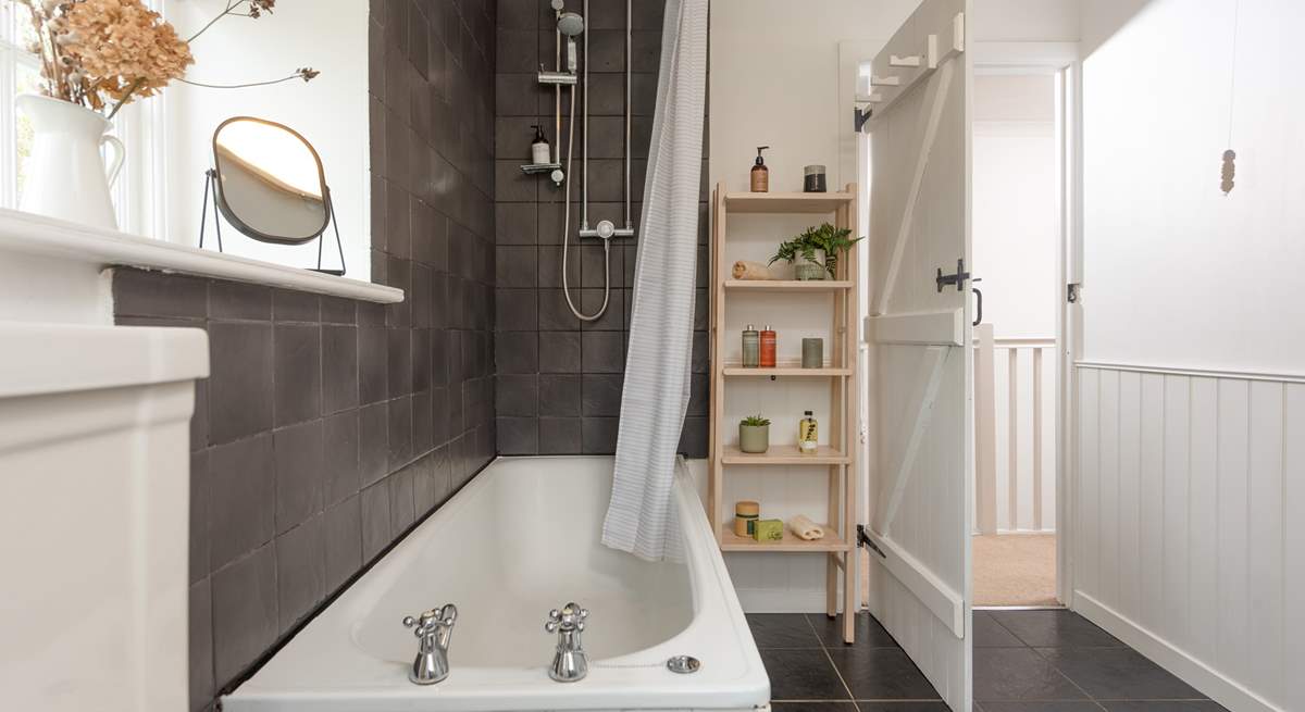 The family bathroom located on the first floor has a bath with shower over.