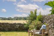Please be mindful of your dogs when in the garden. The field over the hedge often has cows and horses visiting and the farmer would prefer them to be kept quiet. There is an electric wire in place to protect the livestock and keep them safe.