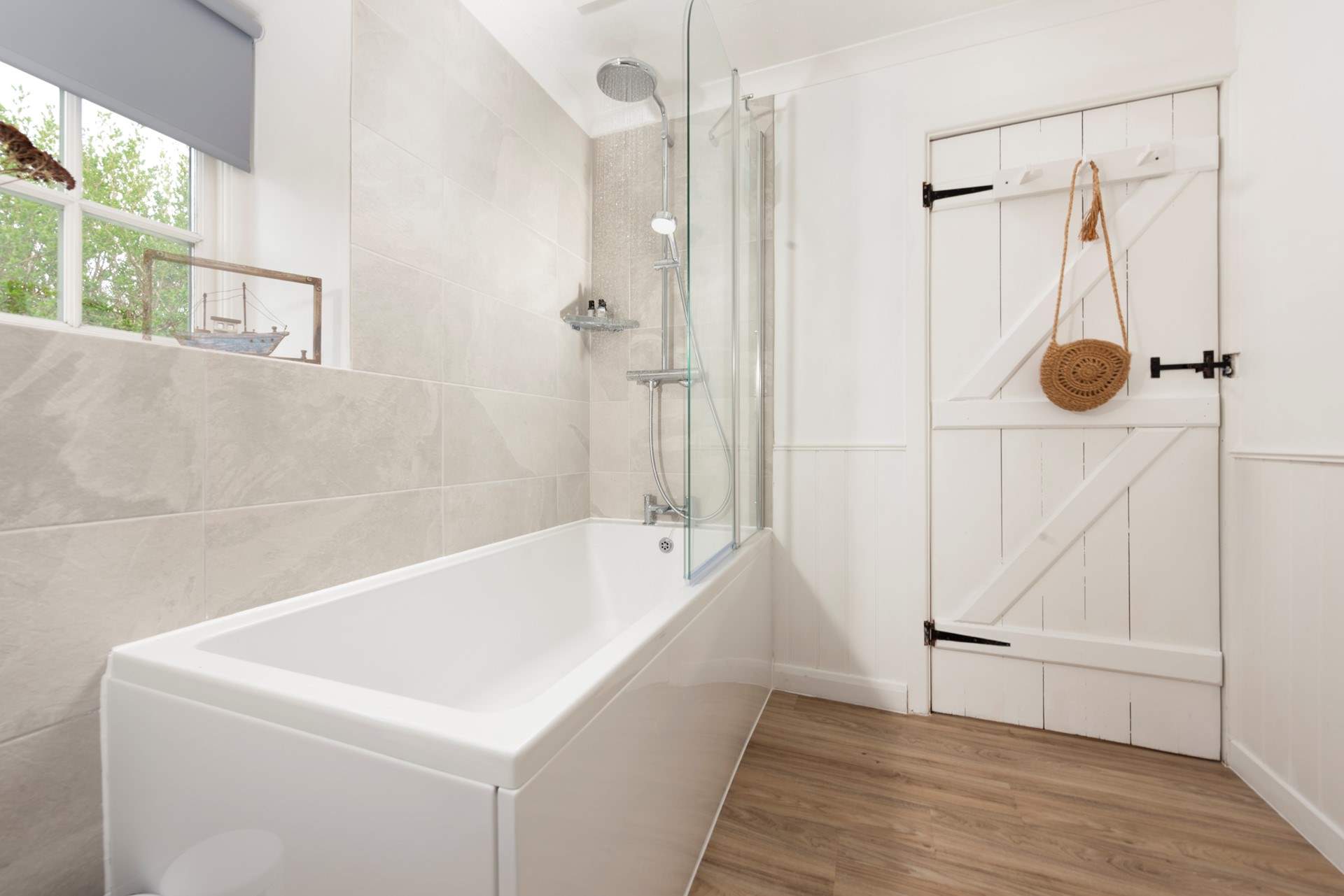 The family bathroom located on the first floor has a bath with shower over.