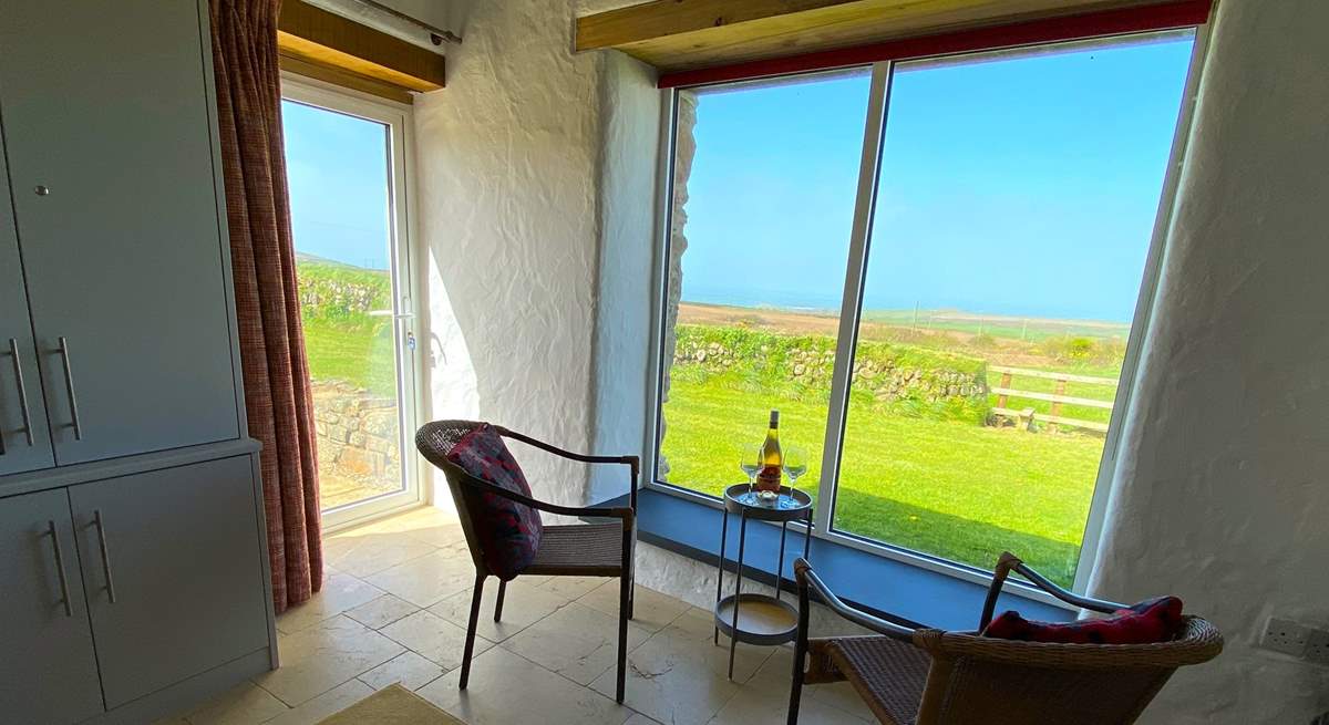 The huge picture window draws the spectacular sea views in. 