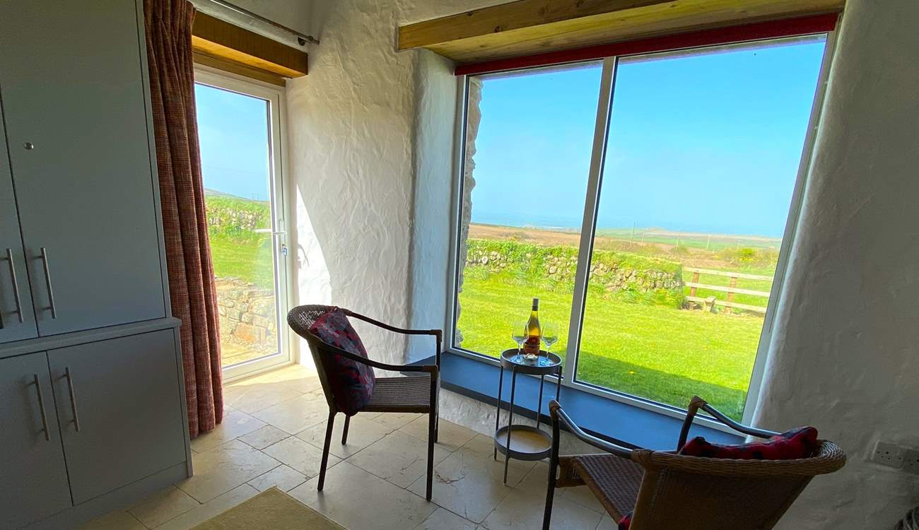 The huge picture window draws the spectacular sea views in. 