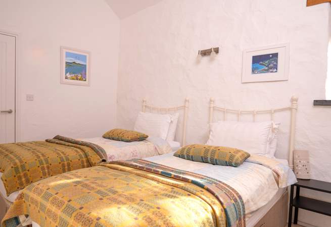 Bedroom 3, a cosy twin room with stylish Welsh furnishings. 