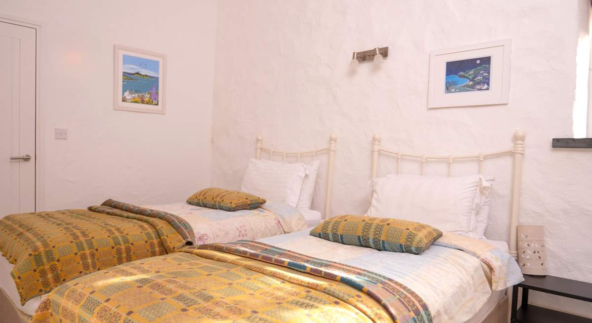 Bedroom 3, a cosy twin room with stylish Welsh furnishings. 