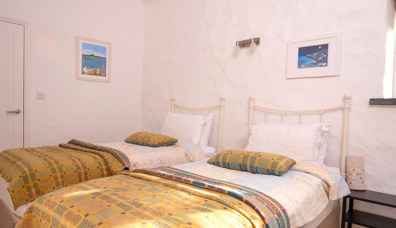 Bedroom 3, a cosy twin room with stylish Welsh furnishings. 