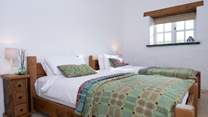 Bedroom 2, a pretty twin with ensuite shower room. 