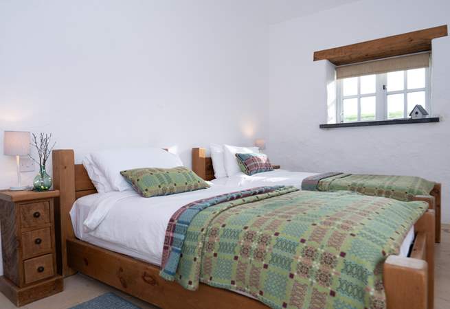 Bedroom 2, a pretty twin with ensuite shower room. 