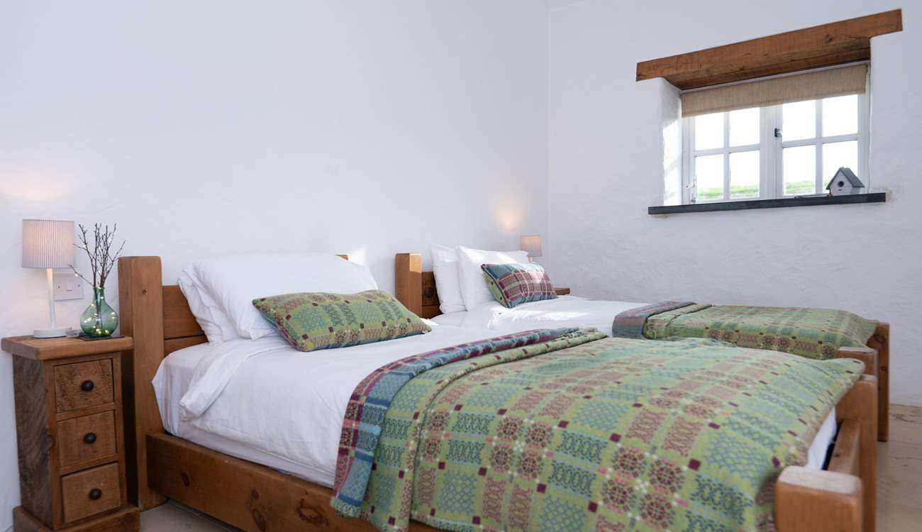 Bedroom 2, a pretty twin with ensuite shower room. 