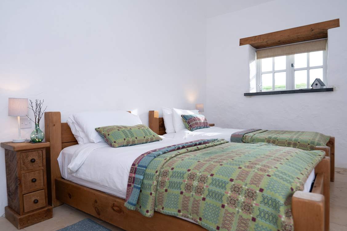 Bedroom 2, a pretty twin with ensuite shower room.