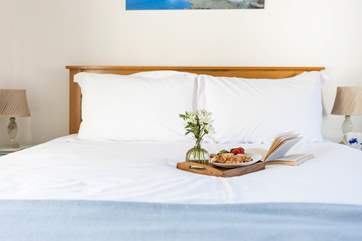 Bedroom 1 has a comfy king-size bed for a restful sleep.