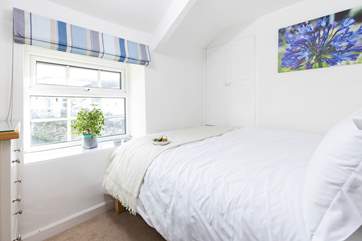 The double bed in bedroom 3 is accessed from one side.