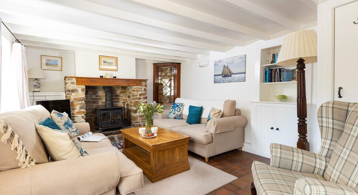 The characterful sitting-room has a warming wood-burner to keep you cosy year round.