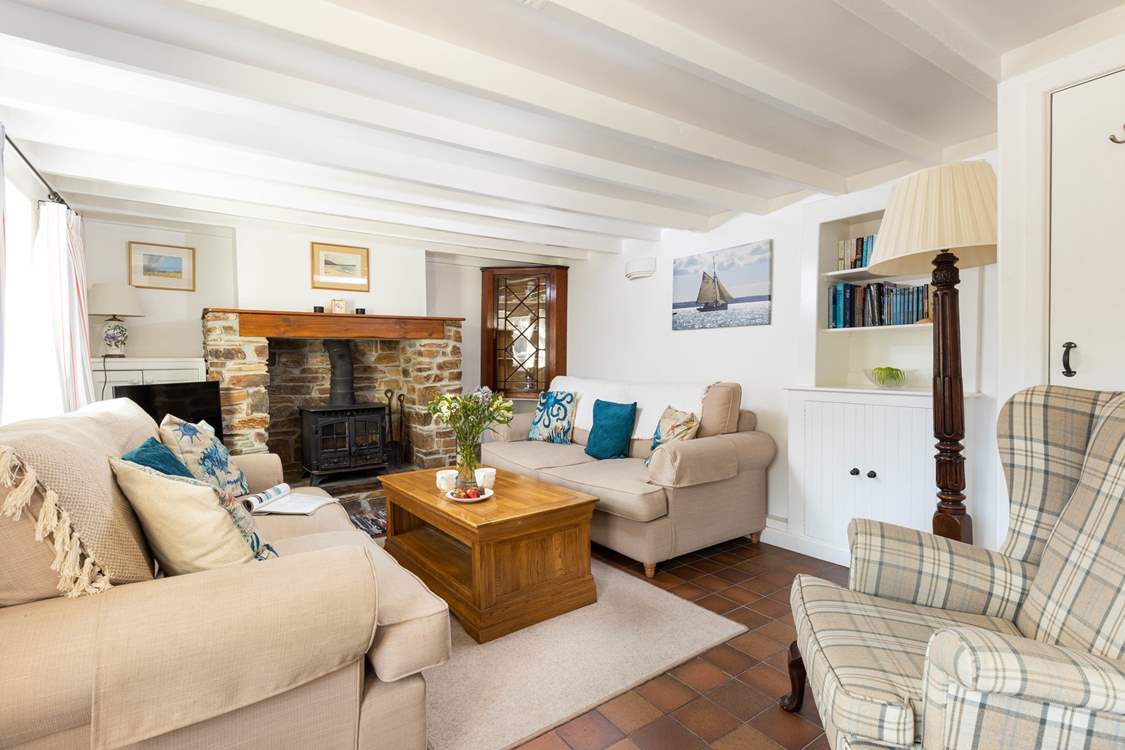 The characterful sitting-room has a warming wood-burner to keep you cosy year round.