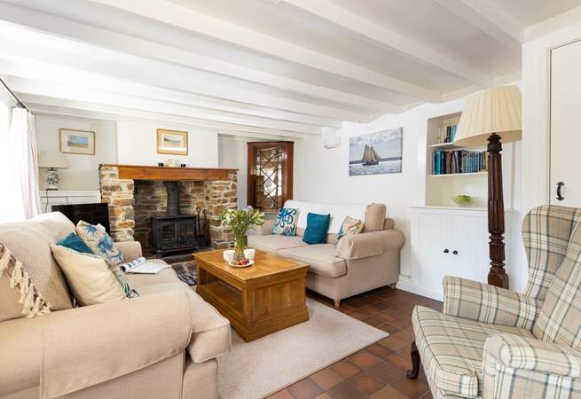 The characterful sitting-room has a warming wood-burner to keep you cosy year round.