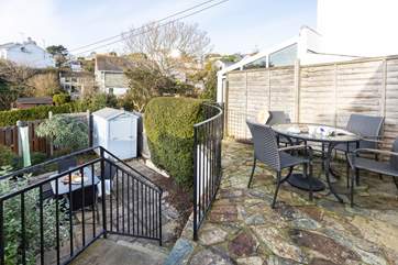 Choose to sit on the upper level, outside the kitchen or down the steps to the lower patio.