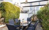 Sit in the Cornish sunshine and enjoy al fresco dining either at the smaller bistro table outside the kitchen or down the steps to the patio. - Thumbnail Image