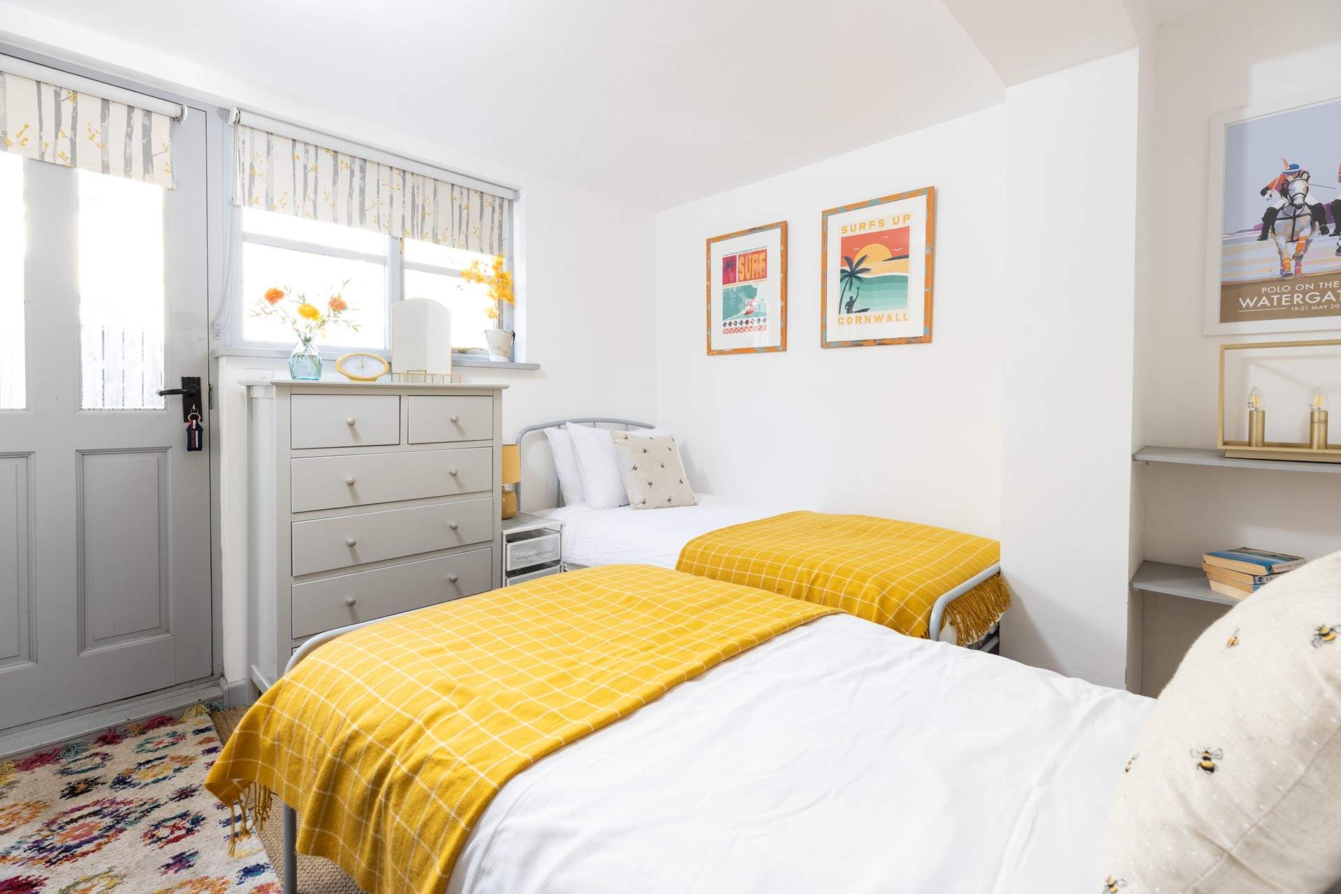 The twin bedroom is at the rear of the cottage and the door leads out onto the patio.