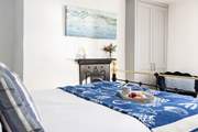 There is a lovely ornamental fireplace in the double bedroom.