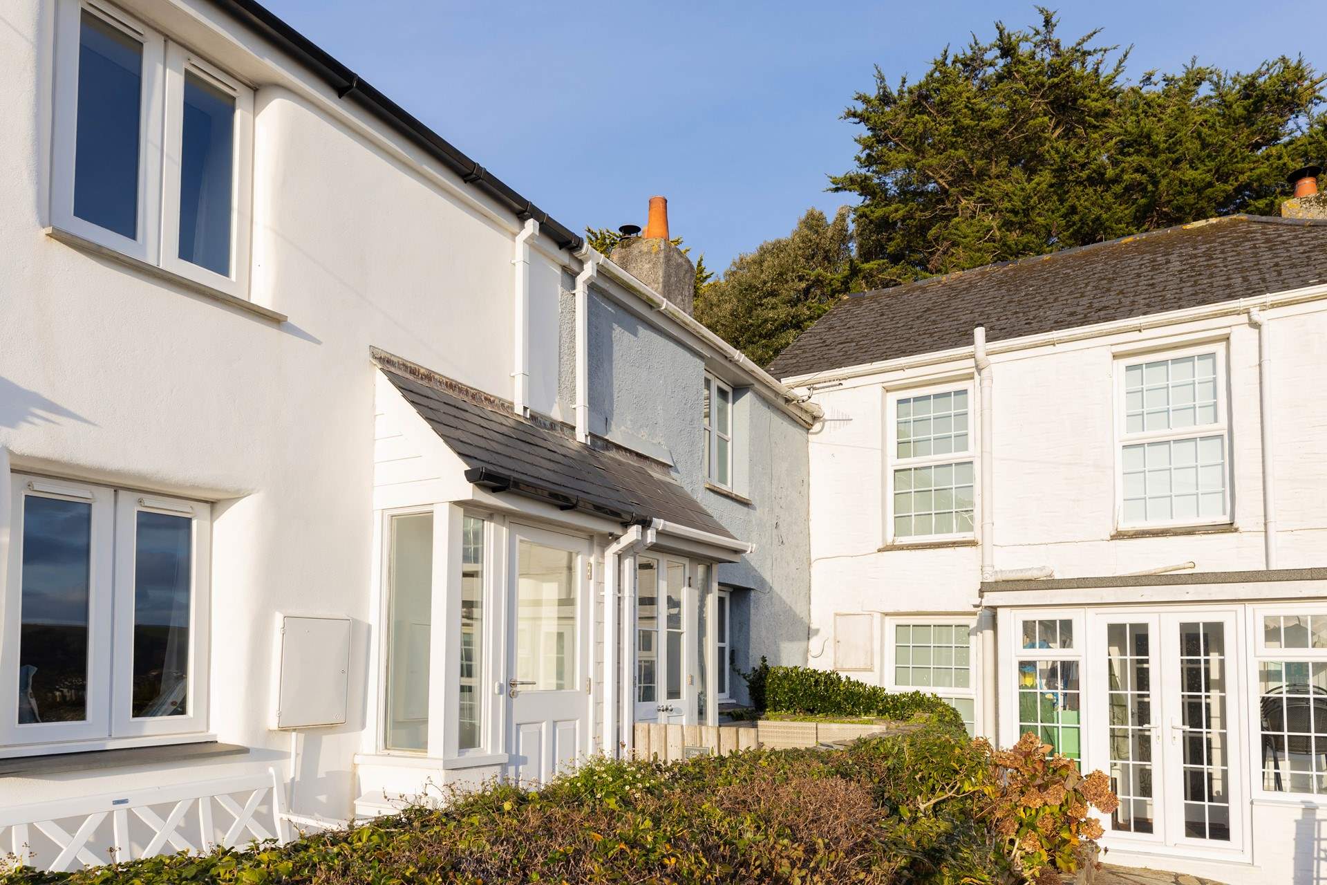 Chapel Cottage is tucked away in the corner, in a row of pretty traditional Cornish cottages.