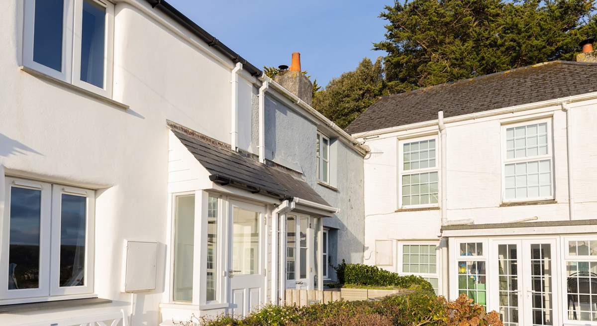 Chapel Cottage is tucked away in the corner, in a row of pretty traditional Cornish cottages.