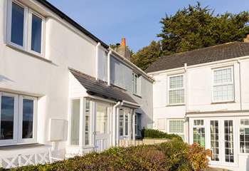 Chapel Cottage is tucked away in the corner, in a row of pretty traditional Cornish cottages.