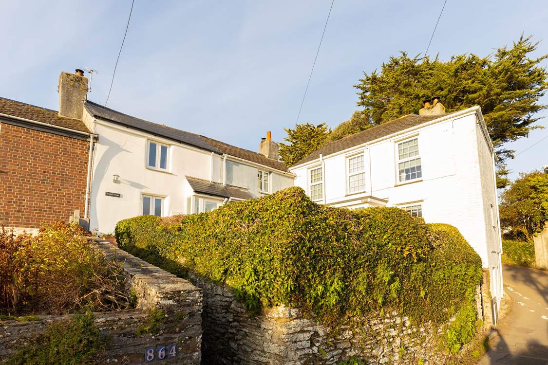 Charming Chapel Cottage is found up the short flight of steps and along the path to the cottage tucked in the corner.