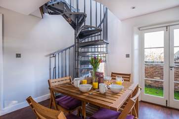 Enjoy a leisurely breakfast. The spiral staircase leads to the first floor.